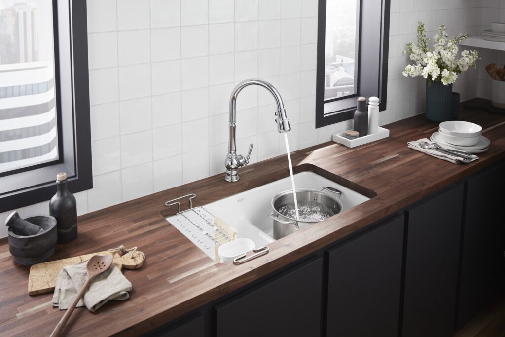 Farmhouse sink on wood kitchen counter | 2024 kitchen and bathroom design trends | Weinstein Broomall