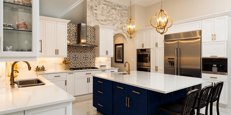 Kitchen with a island with blue cabinetry and a white top | kitchen islands | Weinstein Broomall